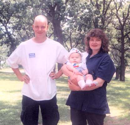 Unknown, Sharon Farrah's sister Margie holding son Devron.