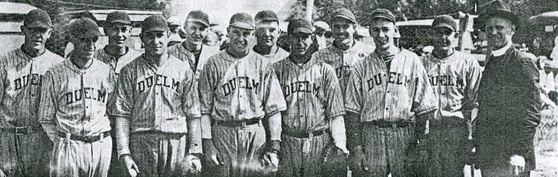 Father Frank J. First, player and coach at far right, and the Duelm baseball team of 1928.