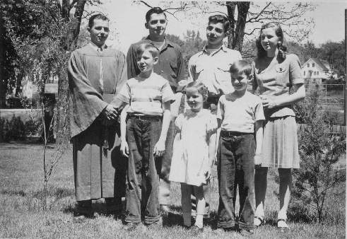 James Mullally with siblings, high school graduation, 1946.