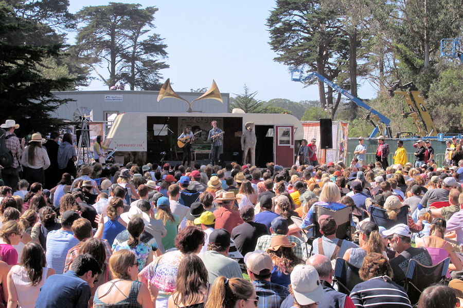 The new Bandstand Stage is made out of an old retro trailer.  Love the cool speakers on top!