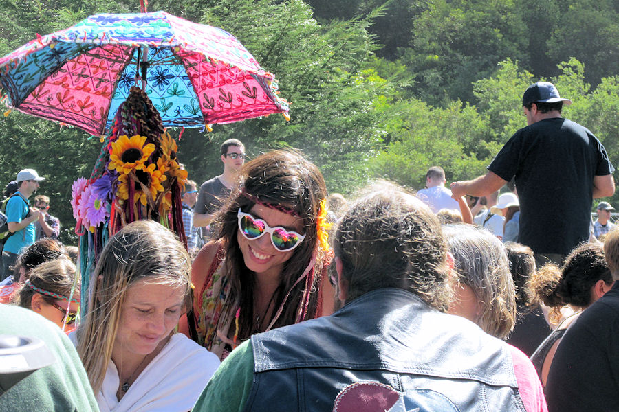 Love-eyed hippie girl selling flower wreaths