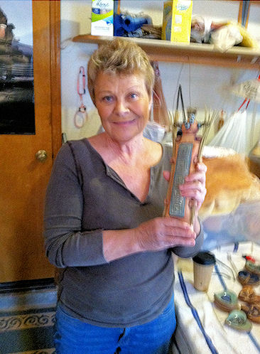 Judy Kampa in her ceramics studio with her art work, 30 Jan 2012