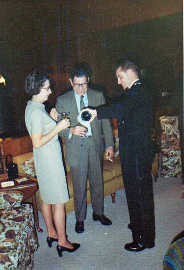 Jane and Bob Newsom being served champagne by Bob Bussell
