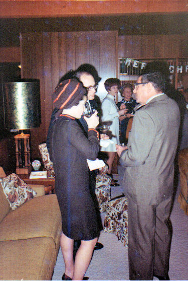 Jane and Bob Newsom being served champagne by Bob Bussell