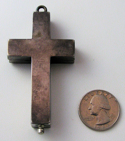Cross back with U.S. Quarter coin for size comparison