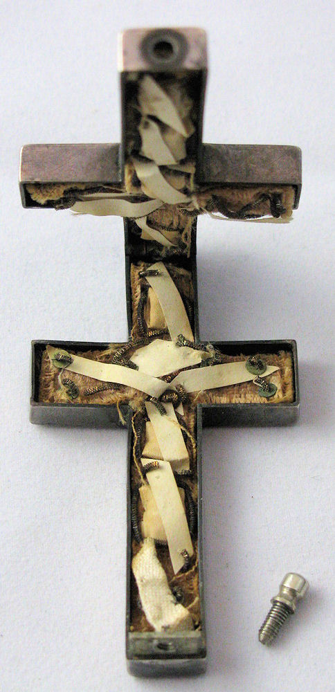 Cross open with screw at lower right