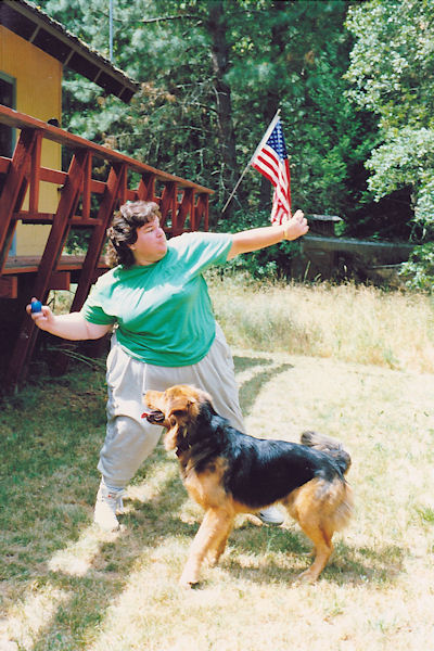 Dana throwing a ball for Sam the dog at the Flaming 'A' Ranch