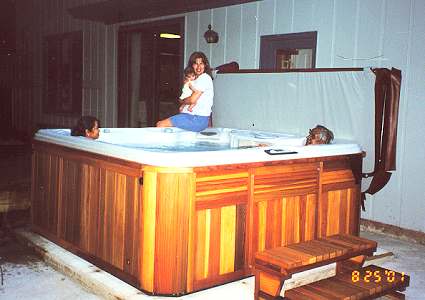 Maya and Diane Anthony with her in-laws in her backyard hot tub.