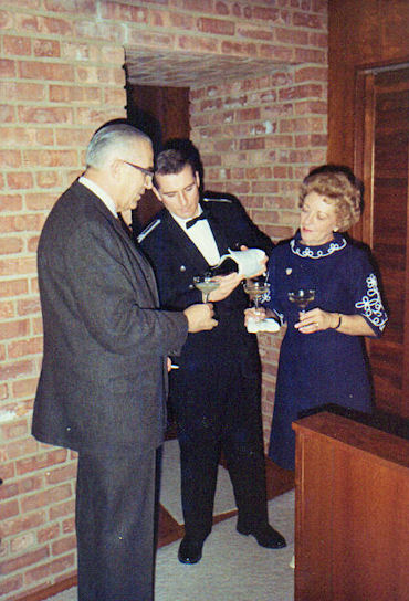 Dick Qvale, Queenie's son Bob Bussell serving champagne, and Queenie Qvale