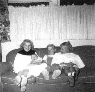 Fran holding Carol, Bob and Peggy Kampa.
