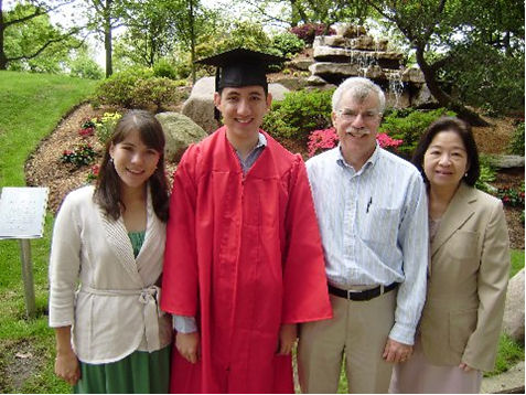 Sister Kelle, graduate Kyle, father Ron and mother Phoung Kampa