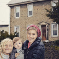 Tanya Bartek family in front of her 4X Great-Grandfather Johann Stimmler's ancestral stone house, Manayunk, PA, Jan. 2015