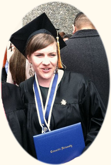 MacKenzie holding her diploma and the nurses pin just above it on the ribbon