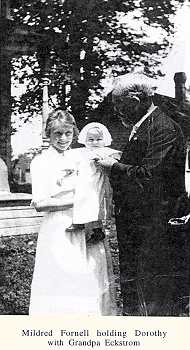 Mildred Fornell holding Dorothy with Grandpa Eckstrom.