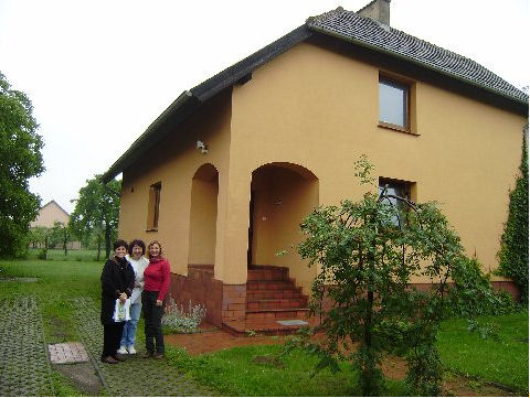 Bonnie, Kinga and Nela beside her office building