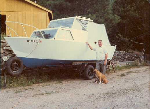 Richard Stimler with his boat and dog at the Flaming 'A' Ranch.