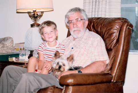 Reha Butros Jr., Oly the dog and Gene Kampa.