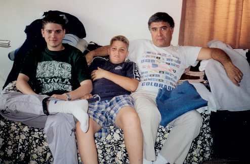 Reha Jr., Tracy and Reha Butros in the living room of their home in Mersin, Turkey, May 2001.