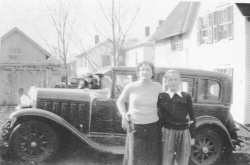 Sister Florence Bordua and brother Robert Bordua with one of their father's old Model T's.