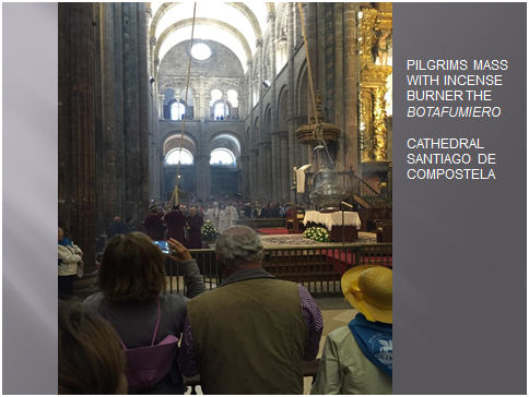 Interior of Cathedral Santiago de Compostela during pilgrims' mass with swinging incense burner, the botafumiero