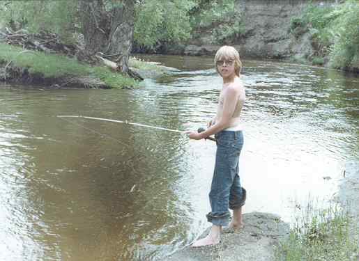 Tom Greenwood fishing in the James River, Jamestown, ND, 1977.