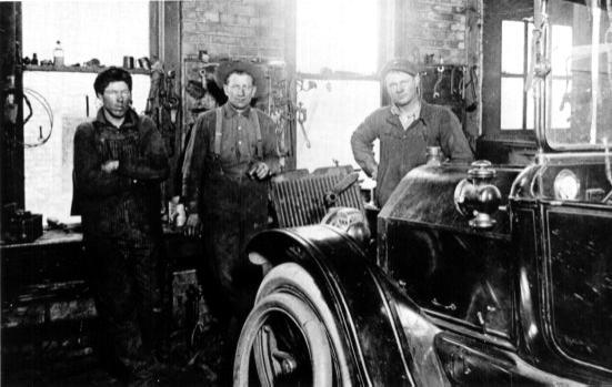 Tony Stimler (center) and two mechanics, Foley, MN, 1911.